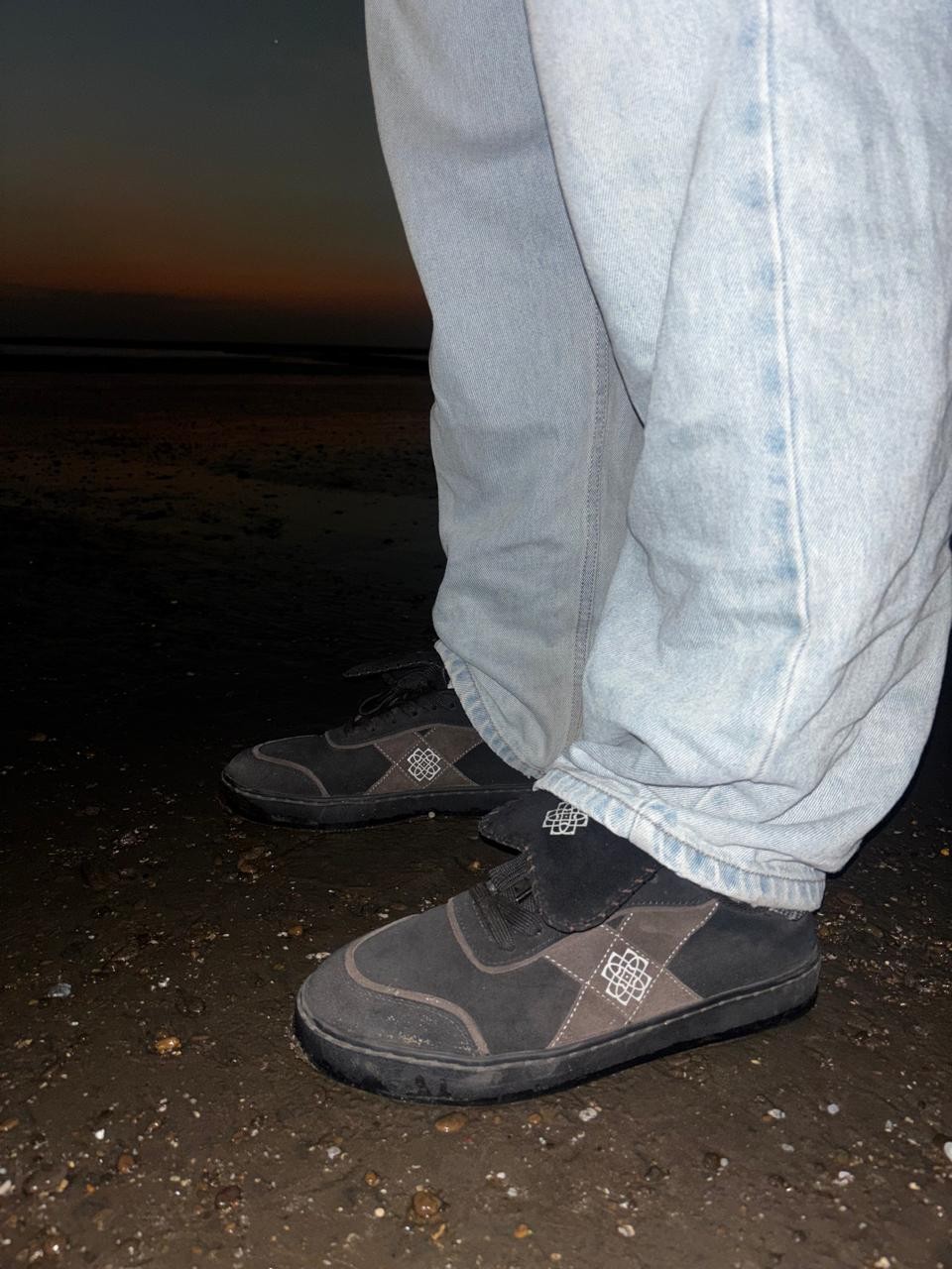 Dark CHRN sneakers paired with light denim